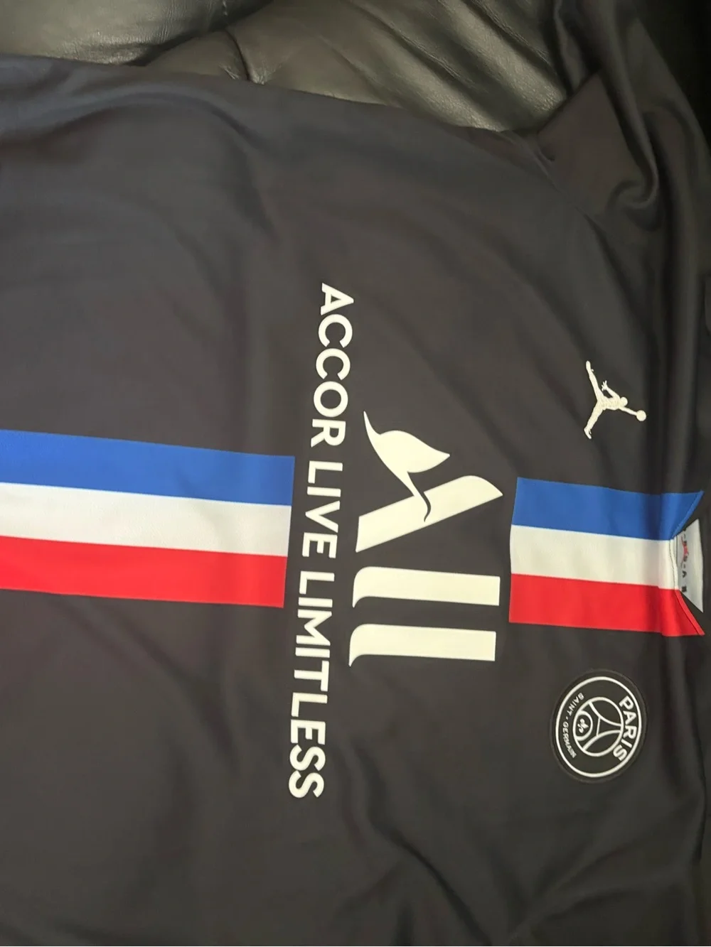 Jordan Men’s Black PSG Football Jersey with Red, White & Blue Stripes